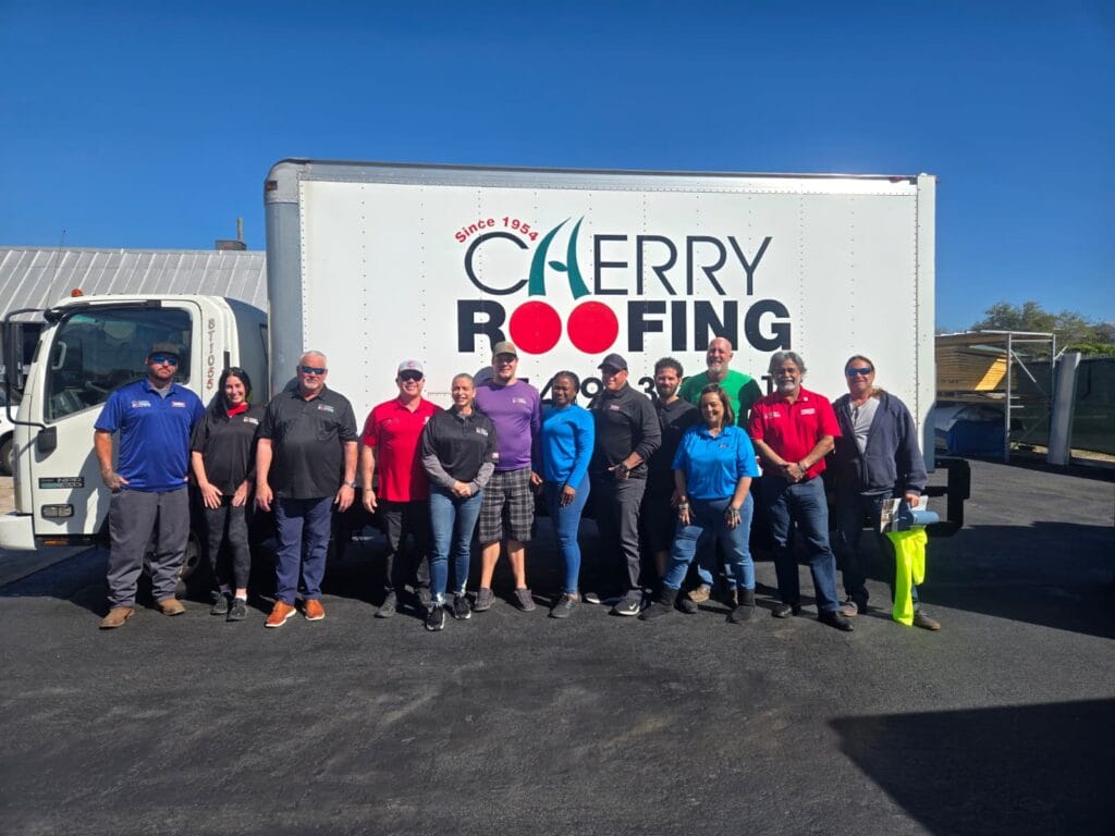 roofing team working on home in South Florida family owned company